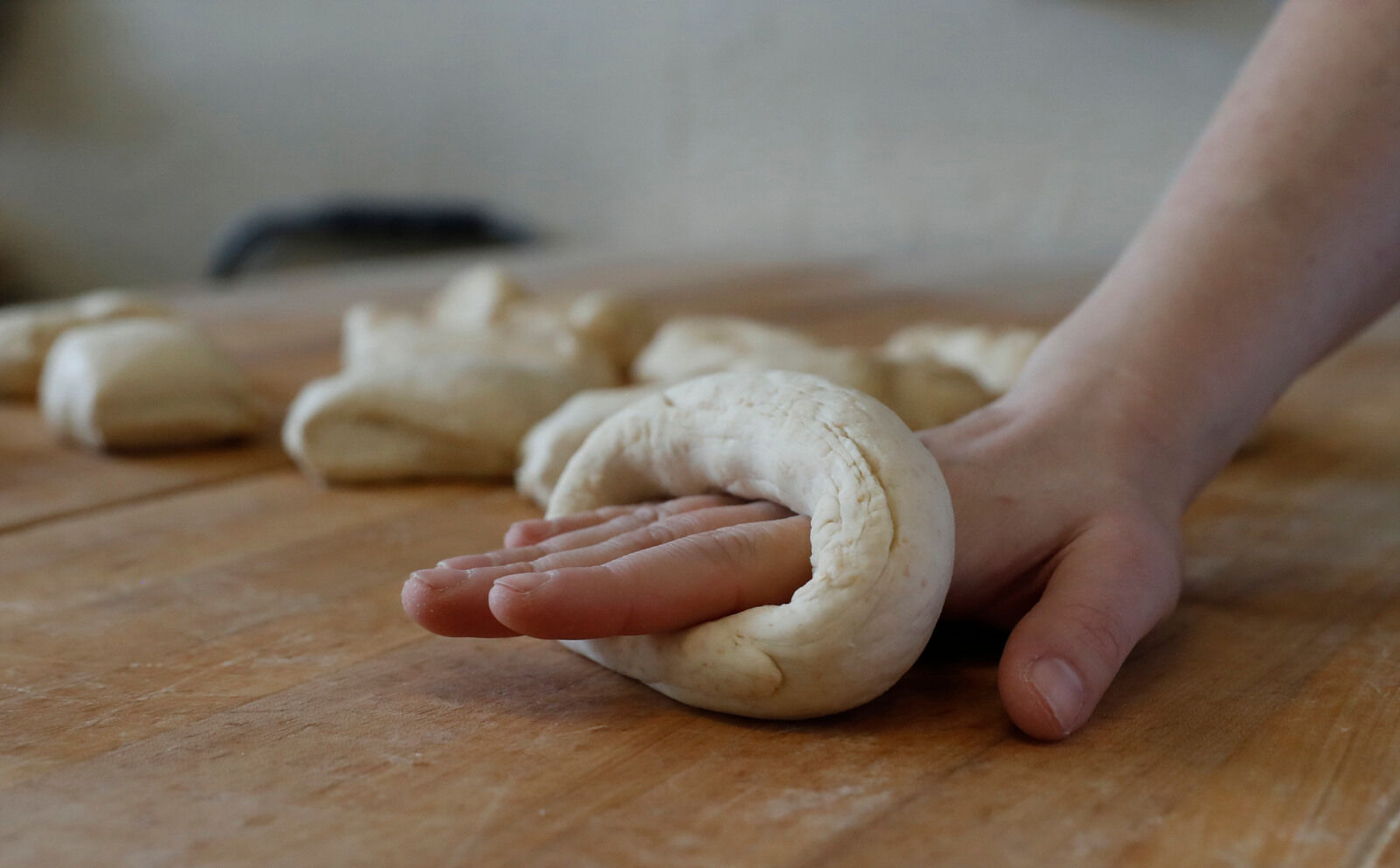 Forming the bagels with expert hands at BreadHive